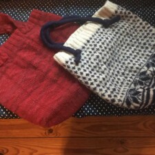 DEBBY LEVINE
Two knitted felled tote bags finished. The red one has been done for years but I had to sew in a pocket and reinforce the bottom. The other I just did this year. It was going to be a sweater but was too small so it became a tote bag.