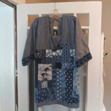 ALYCE MCDONALD
When Roy and I were in Japan years ago, I bought this "Happy Coat" apron. Loved it and used it to cook in. Then I wore it to paint in--big mistake!
So when our lock down started I decided to patch over all the paint spots, of which there were many.
I used shibori printed short pieces I bought online from Debby Maddy and fabric samples I got from a company like Wayfare, not really sure.
Also used an Asian Print of women to cover the pocket.
Used my own interpretation of Japanese stitching on my sewing machine.
Took a lot of time but am very happy with the results.
No more painting in it!!!!