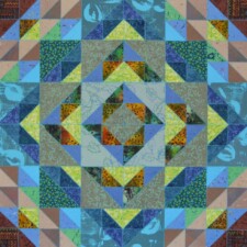 WENDY DUNLEAVY
I incorporated as many fabrics and papers as I could that were printed with leaf and vine designs to emphasize the theme of renewal. Having played with this design before, I chose it this time because it expands outwards (like the spread of the coronavirus) but before reaching the corners, it seems to reverse and point back to the center, ultimately suggesting containment.