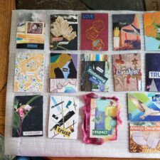 FRAN ENGLANDER
On the last page of the book (opposite the inside back cover) is a pocket (made from a portion of the envelope that held some of the "seeds" I was given) that reads, "Options." The artist trading cards fit in there. The cards have an ongoing set of themes, and two cards include an "art seed" each. There is an option to pick a card of the day to clip on the front of the book (the clip also came with my "seeds.")